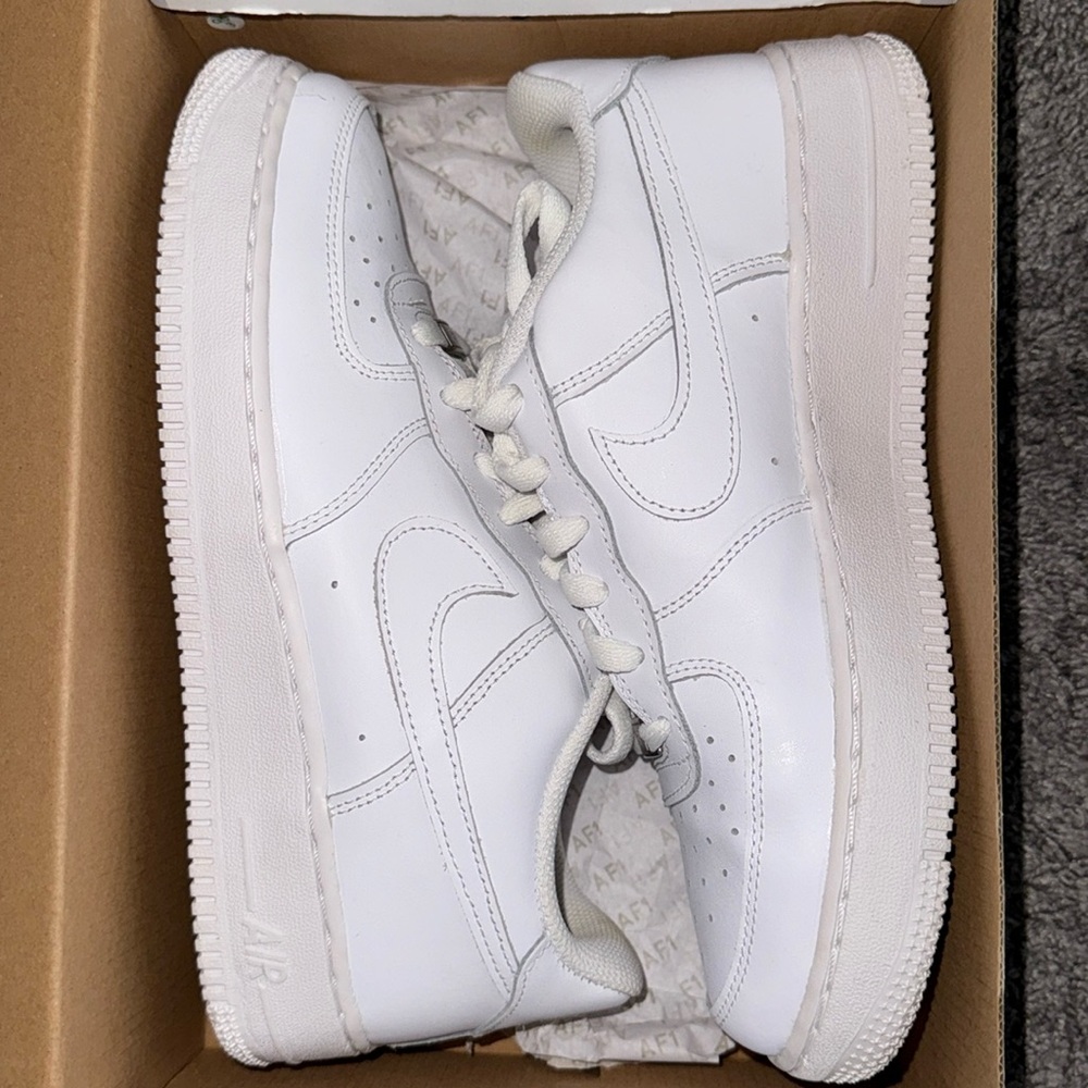 All white Nike Air Force 1s